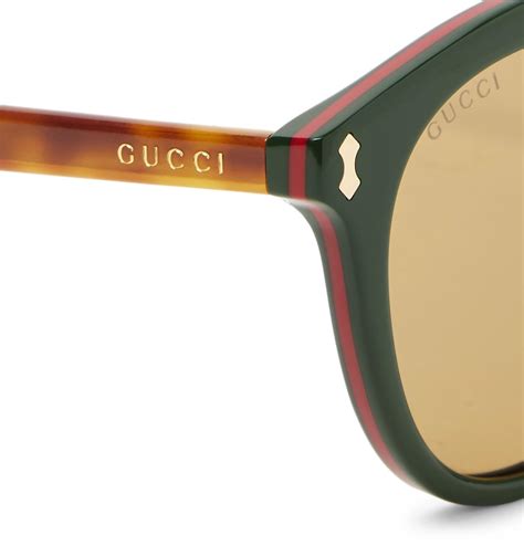 gucci sunglasses tan and green swirl frame|Gucci 55mm round sunglasses.